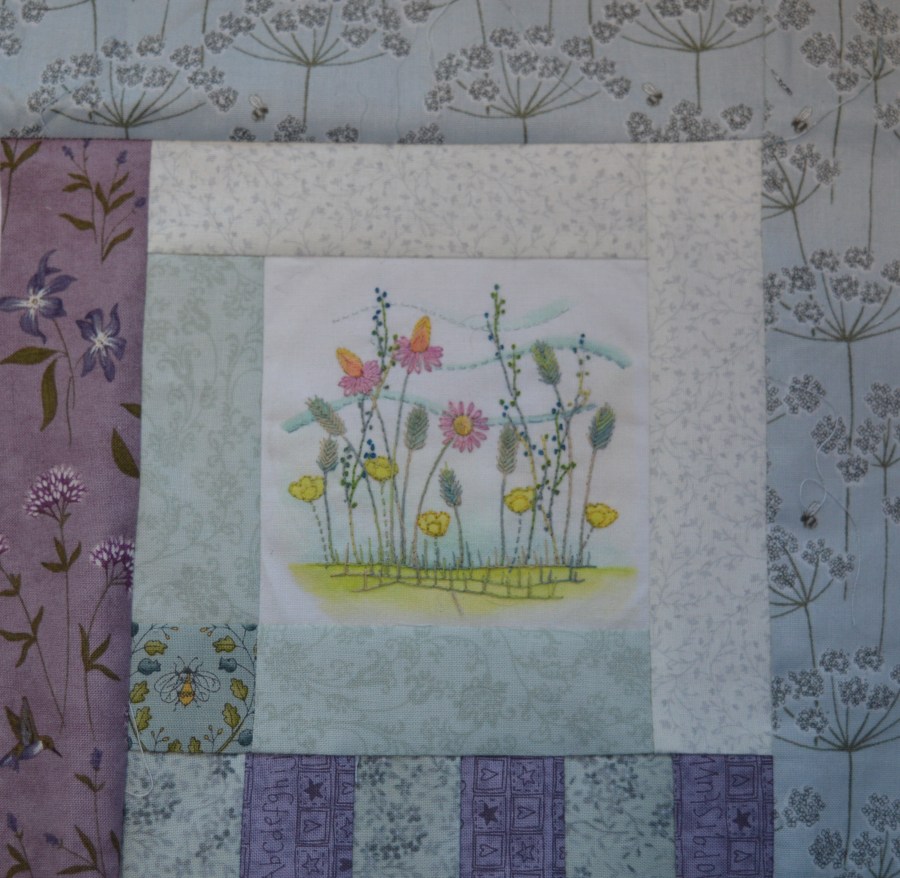 Embroidered filed of flowers